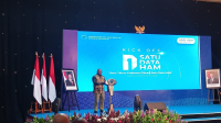 Menteri HAM Natalius Pigai saat memberikan sambutan di acara 'Kick Off Satu Data HAM' di Jakarta, Jumat, 21/11/2025 | Syahrul Baihaqi/Forum Keadilan