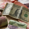 Dollar dan Rupiah. | Ist