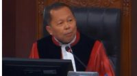 Hakim Mahkamah Konstitusi (MK) Arsul Sani di sidang putusan gugatan syarat pendidikan Wapres Gibran Rakabuming Raka, Selasa, 6/10/2026 | YouTube Mahkamah Konstitusi
